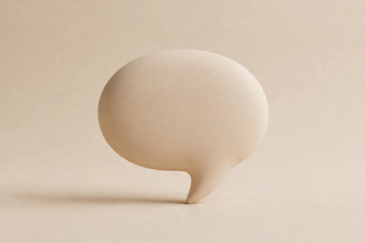 A sand coloured speech bubble shape
